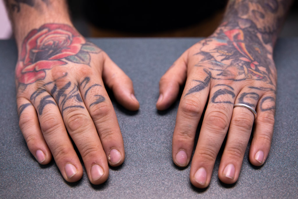 tattooed hands