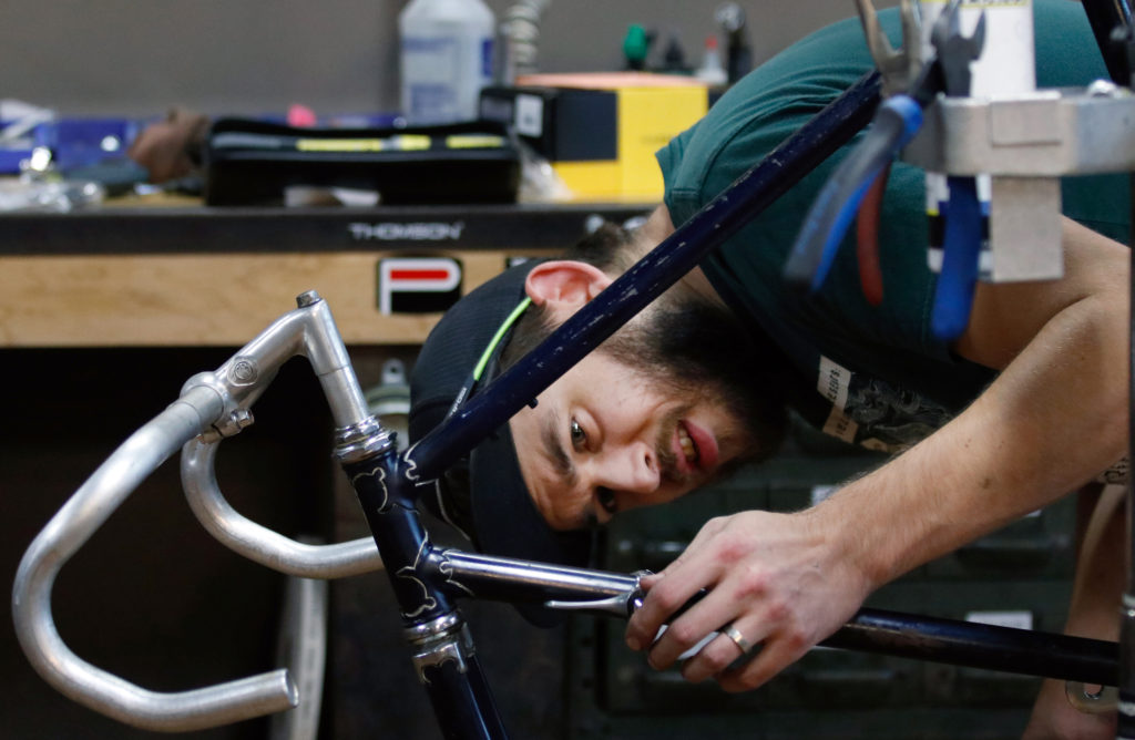 man fixing bike